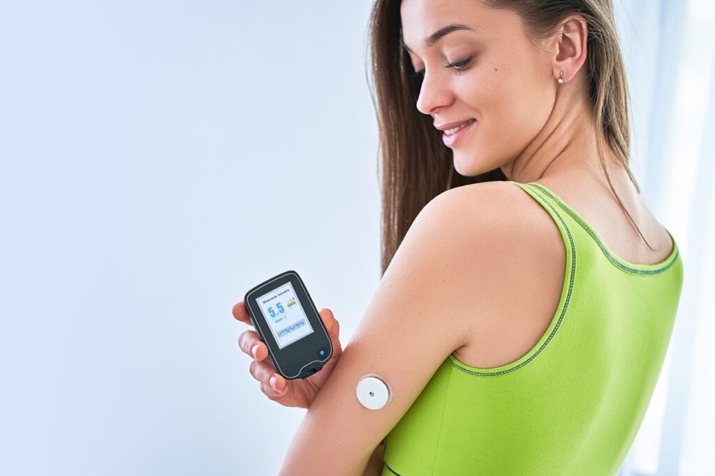 Woman checking glucose level with a remote sensor to help with managing diabetes.