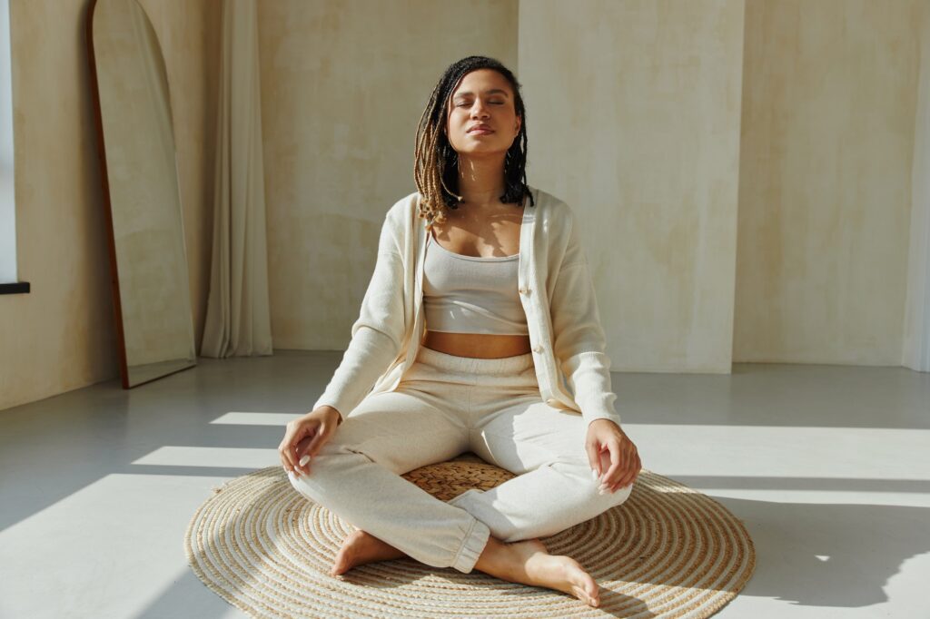 Young black woman practicing meditation.